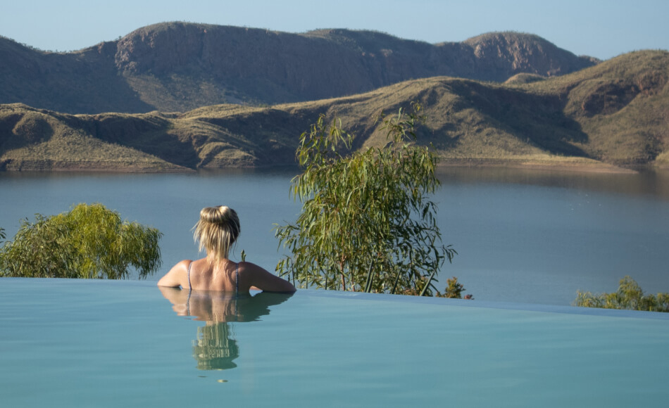 woman taking a swim overlooking Lake Argyle