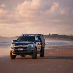 Ute on the beach in Australia with a Ute Canopy ready to explore