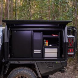 chassis mount canopy with the doors open in the bush